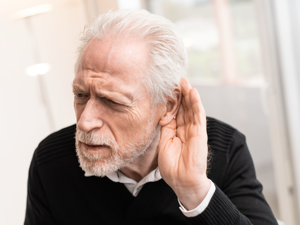 Patient learning about hearing loss types at Physicians Hearing Clinic in Sarasota, FL