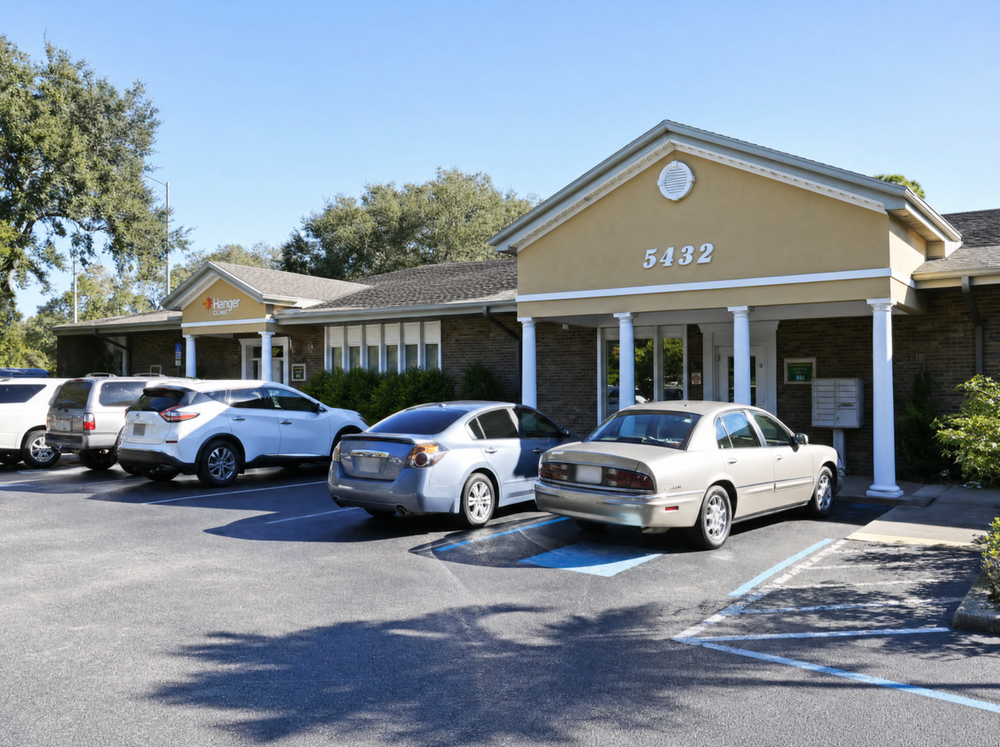 Patient care coordinator reviewing CareCredit and insurance options at Physicians Hearing Clinic on Bee Ridge Road in Sarasota, FL