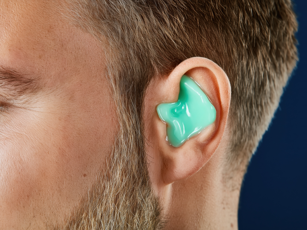 Audiologist taking ear impressions for custom earmolds at Physicians Hearing Clinic in Sarasota, FL
