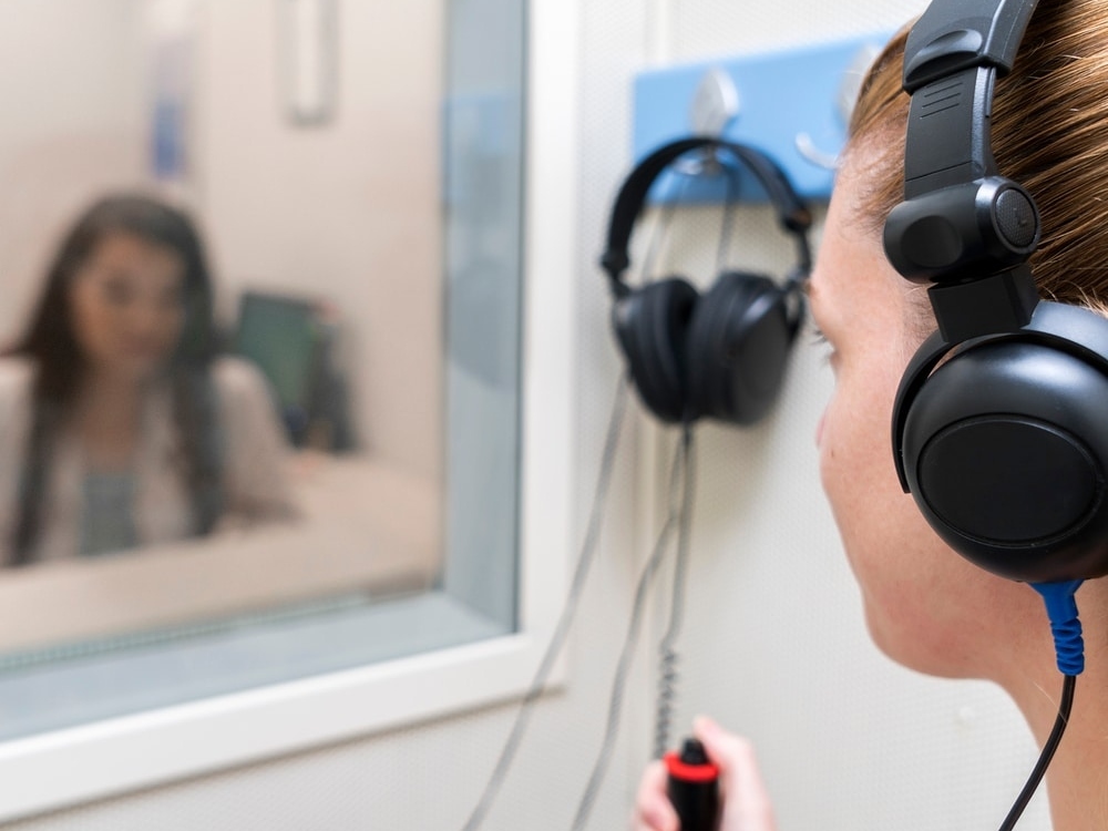 Doctor of Audiology conducting a comprehensive hearing evaluation with a patient at Physicians Hearing Clinic in Sarasota, FL