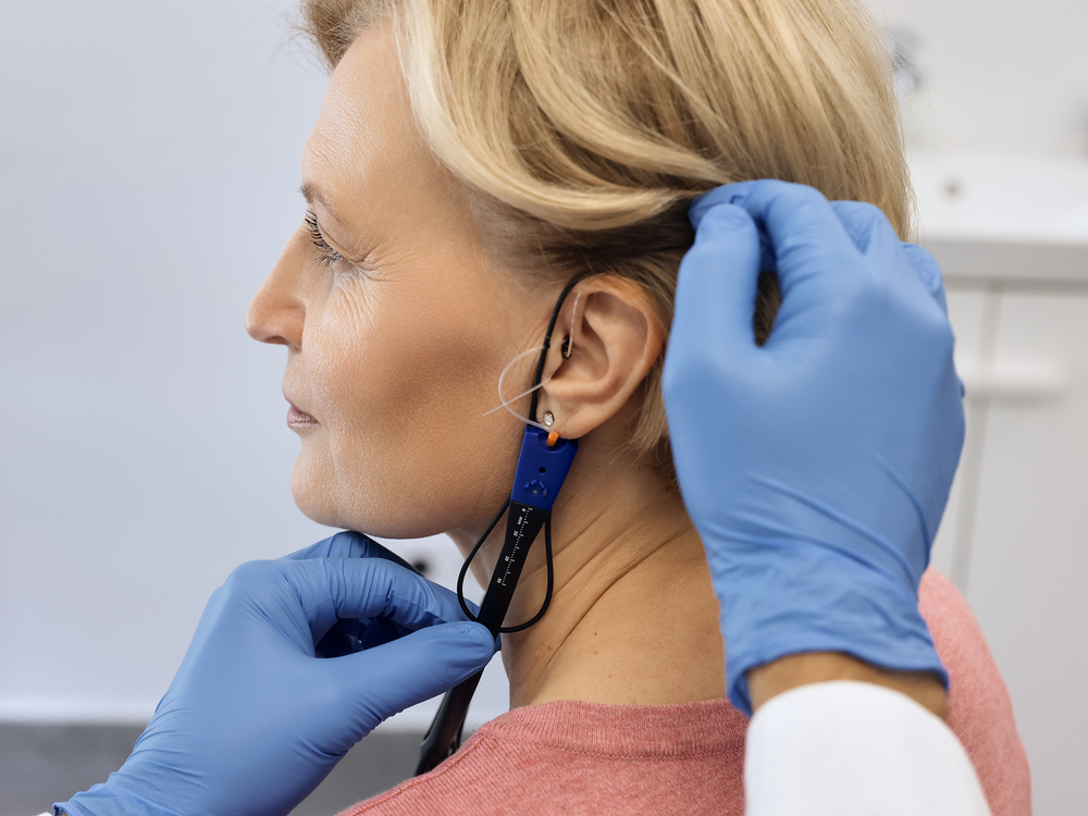 Real-ear measurement and prescription verification during a hearing aid fitting at Physicians Hearing Clinic on Bee Ridge Road in Sarasota